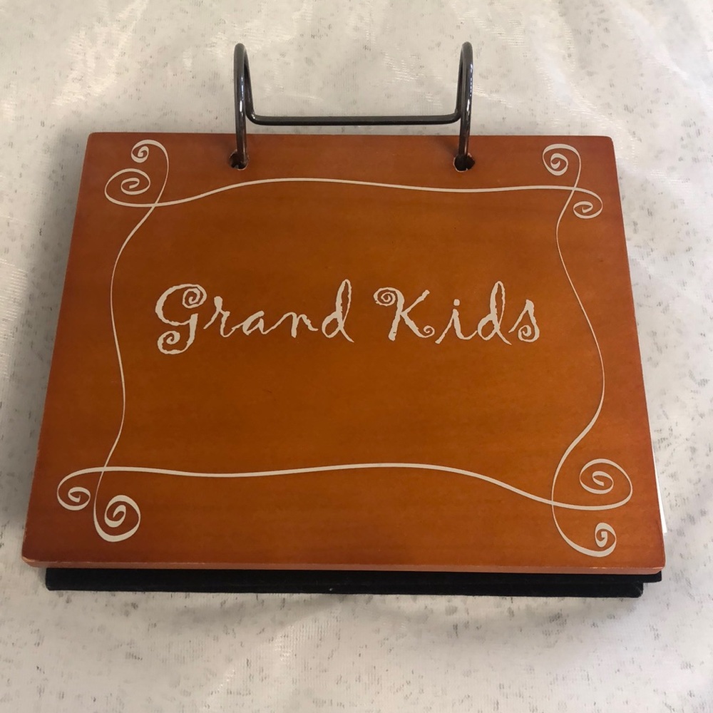 Photo album. “Grand Kids” on cover. 4” x 6”. Never used.
